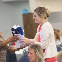 distributing prize at luncheon